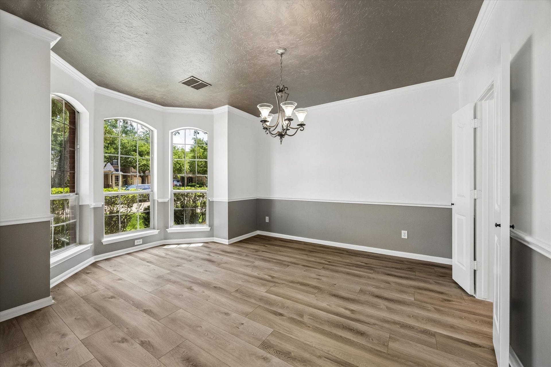 1331 SHADY BEND DRIVE, Sugar Land, TX 77479 The formal dining room offers elegant windows, crown molding, and plenty of space for hosting family and friends.