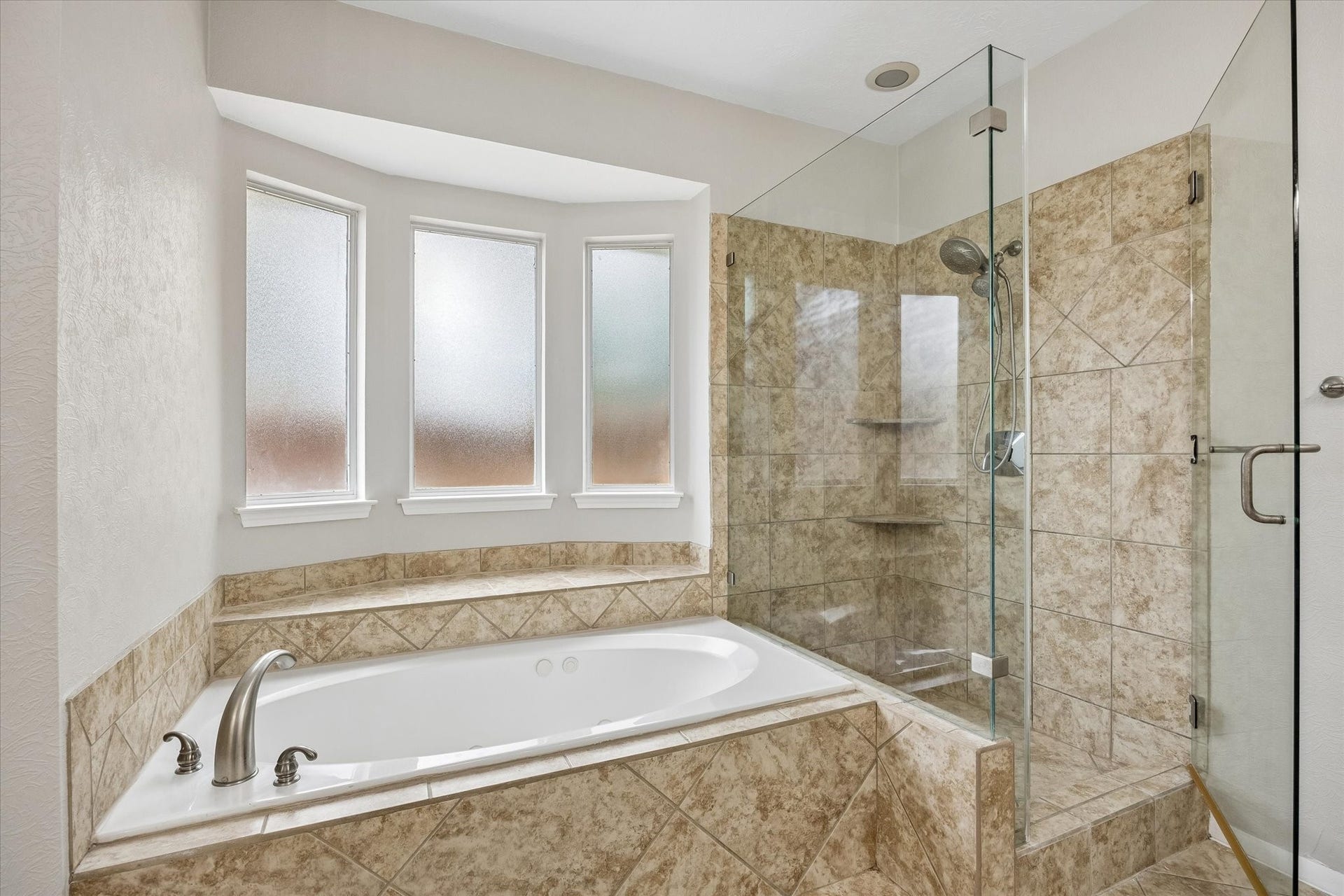 1331 SHADY BEND DRIVE, Sugar Land, TX 77479 Relax in the oversized soaking tub or enjoy the separate frameless glass walk-in shower.