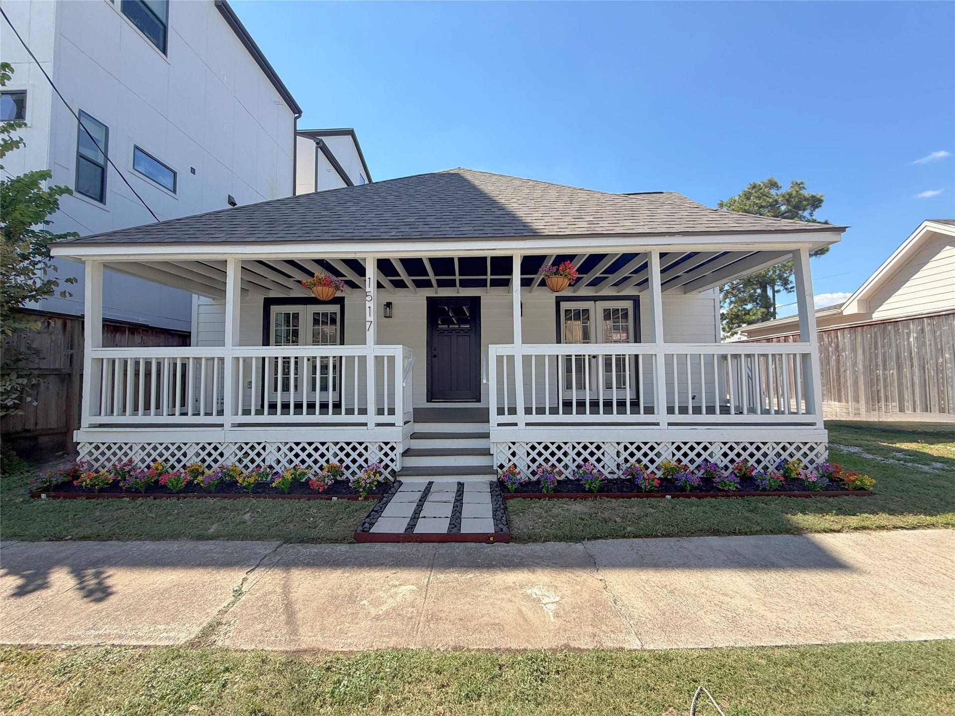 1517 COLORADO Street, Houston, TX 77007 Beautifully updated home featuring a welcoming, double-wide covered front porch, fresh landscaping, and charming architectural details that enhance its curb appeal AND A NEW ROOF!