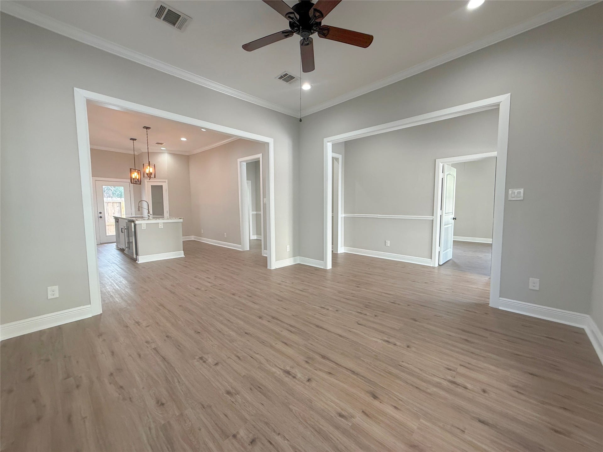 1517 COLORADO Street, Houston, TX 77007 Wide openings create a seamless connection between the living room, kitchen, and adjoining interior spaces, providing an open, versatile floor plan.