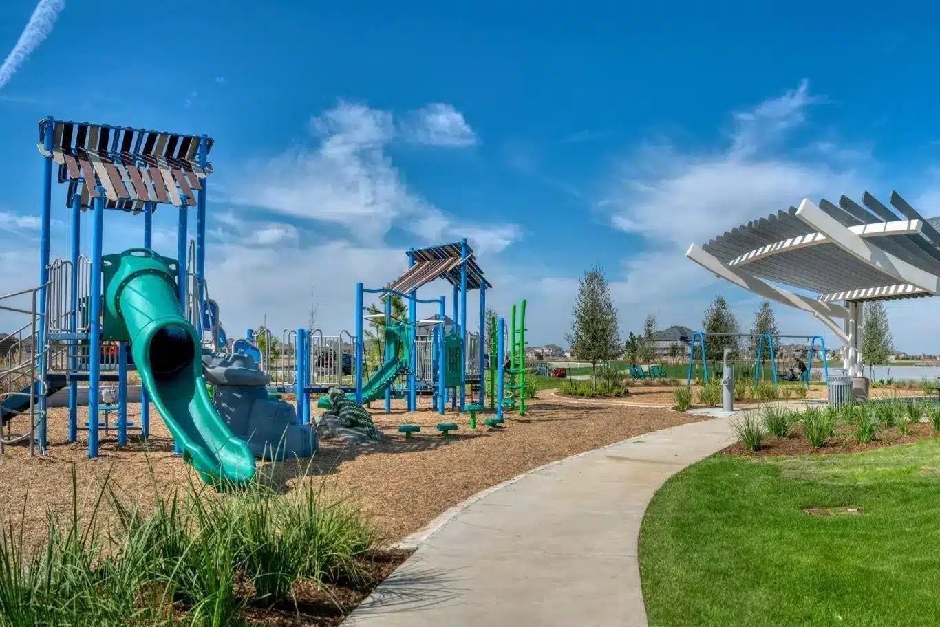 21903 Scoober Creek Drive, Cypress, TX 77433 The vibrant community playground offers a safe, shaded recreational haven complete with modern play structures, swings, a pavilion, and a walking path.
