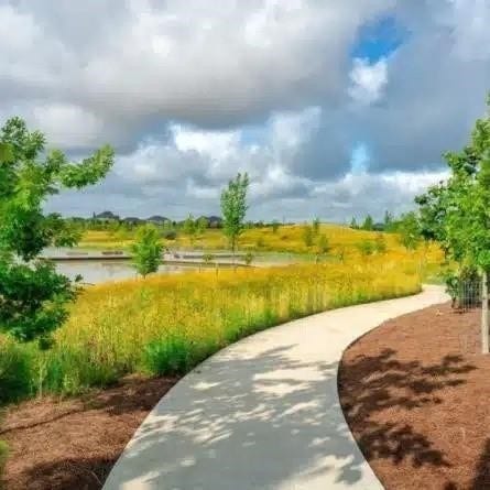 21903 Scoober Creek Drive, Cypress, TX 77433 This beautifully landscaped community walking trail offers a serene escape, perfect for daily strolls amidst rolling greenery and native wildflowers.