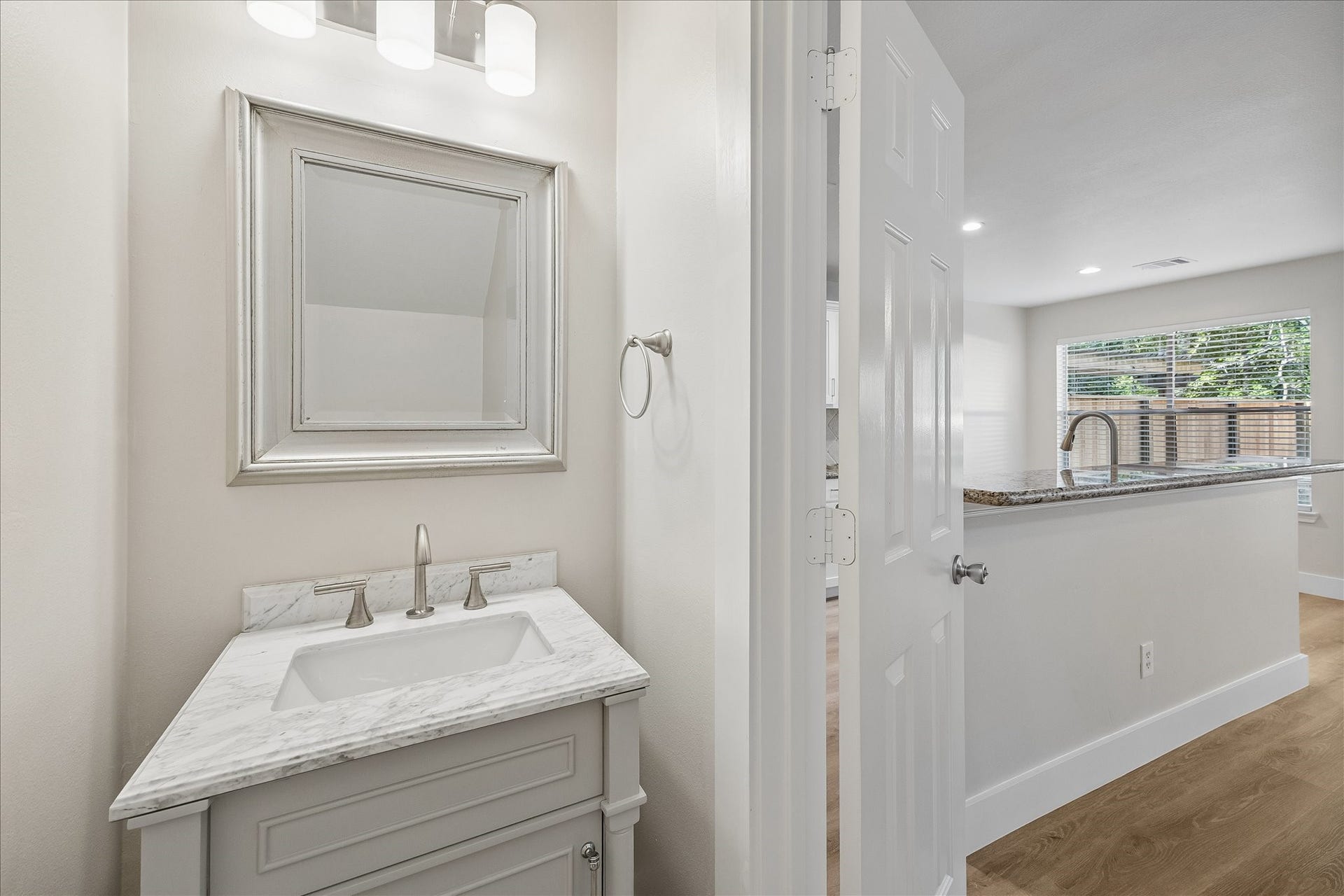 90 N Walden Elms Circle, Spring, TX 77382 First-floor powder room with a stylish new vanity.