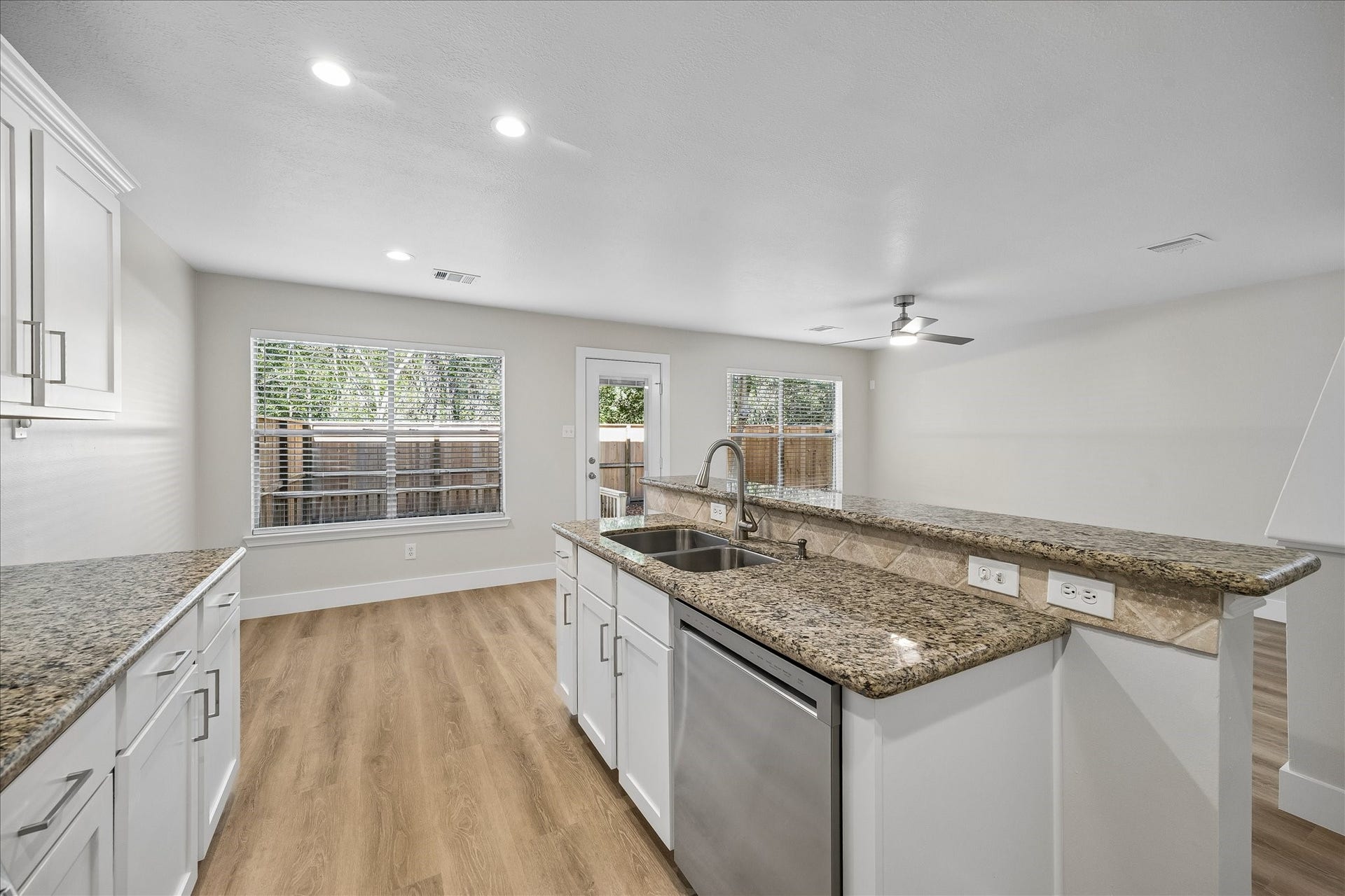 90 N Walden Elms Circle, Spring, TX 77382 The kitchen features granite counters and all new appliances.