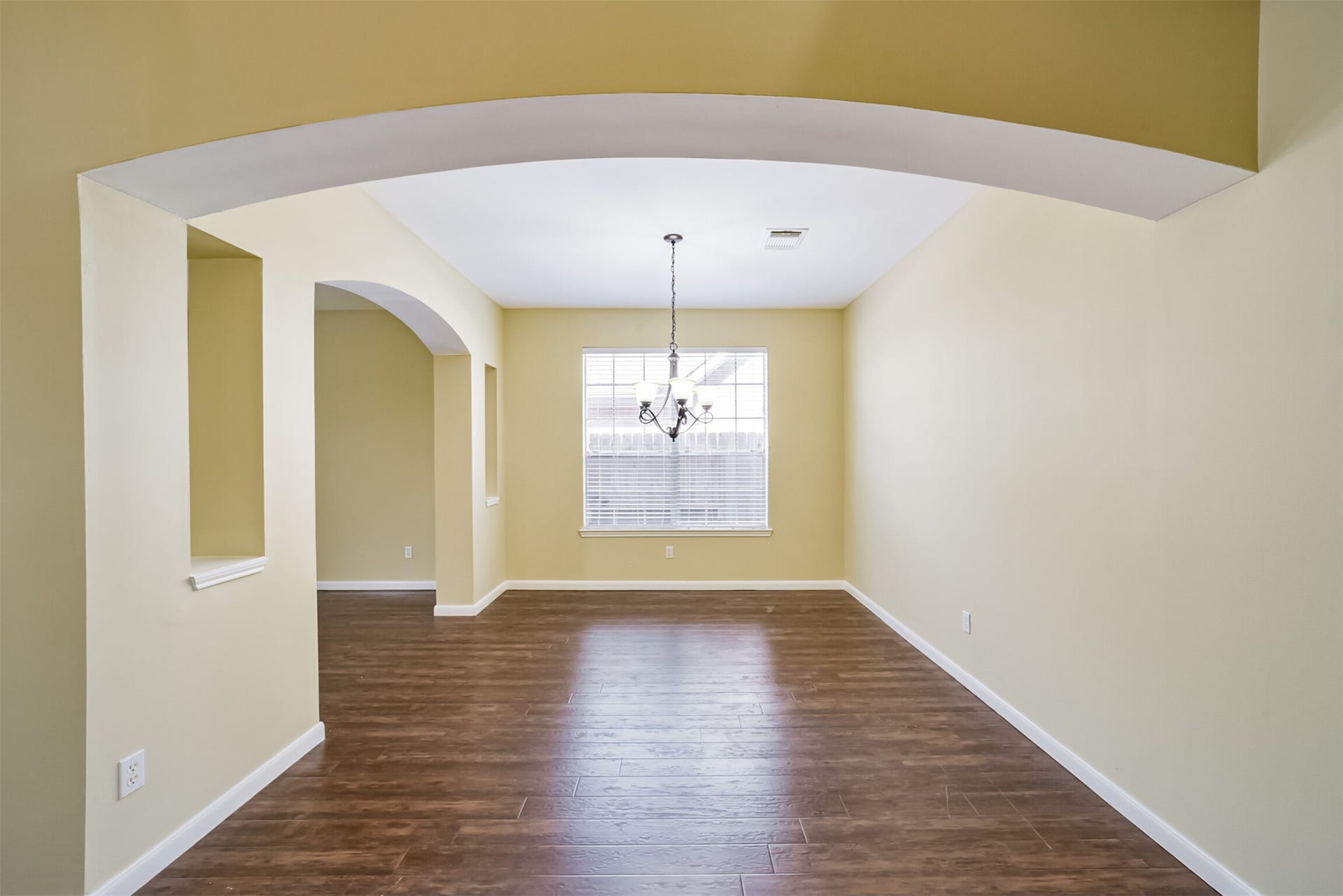 Formal dining room with beautiful arches.