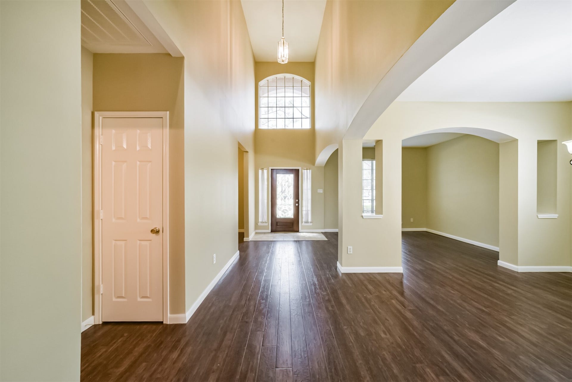 Welcoming entry with high ceilings and natural light.