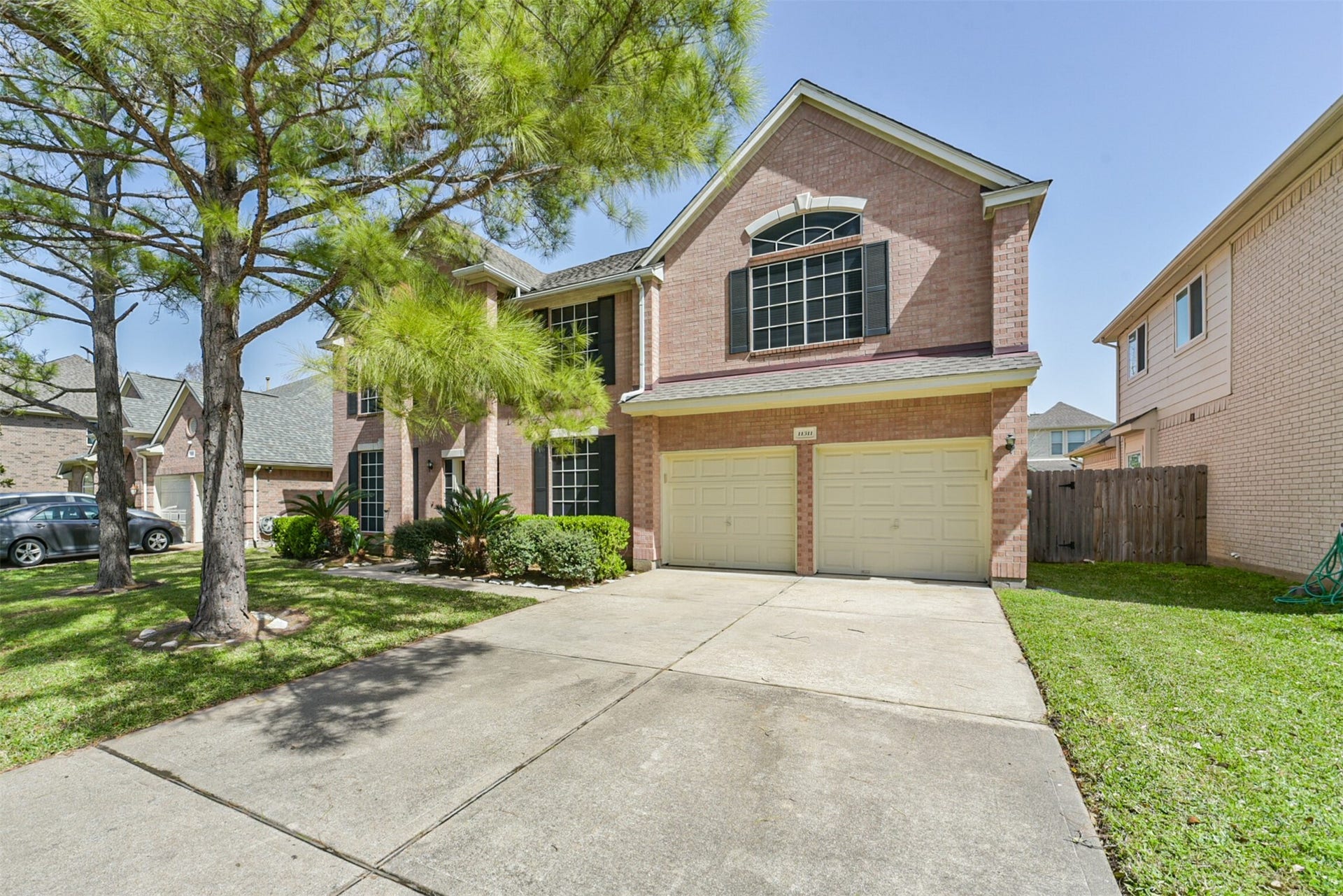 Attached 2-car garage and extended driveway.