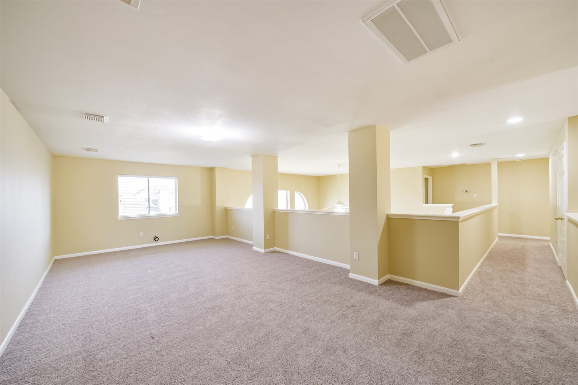 Upstairs den with generous space, positioned away from the bedrooms.