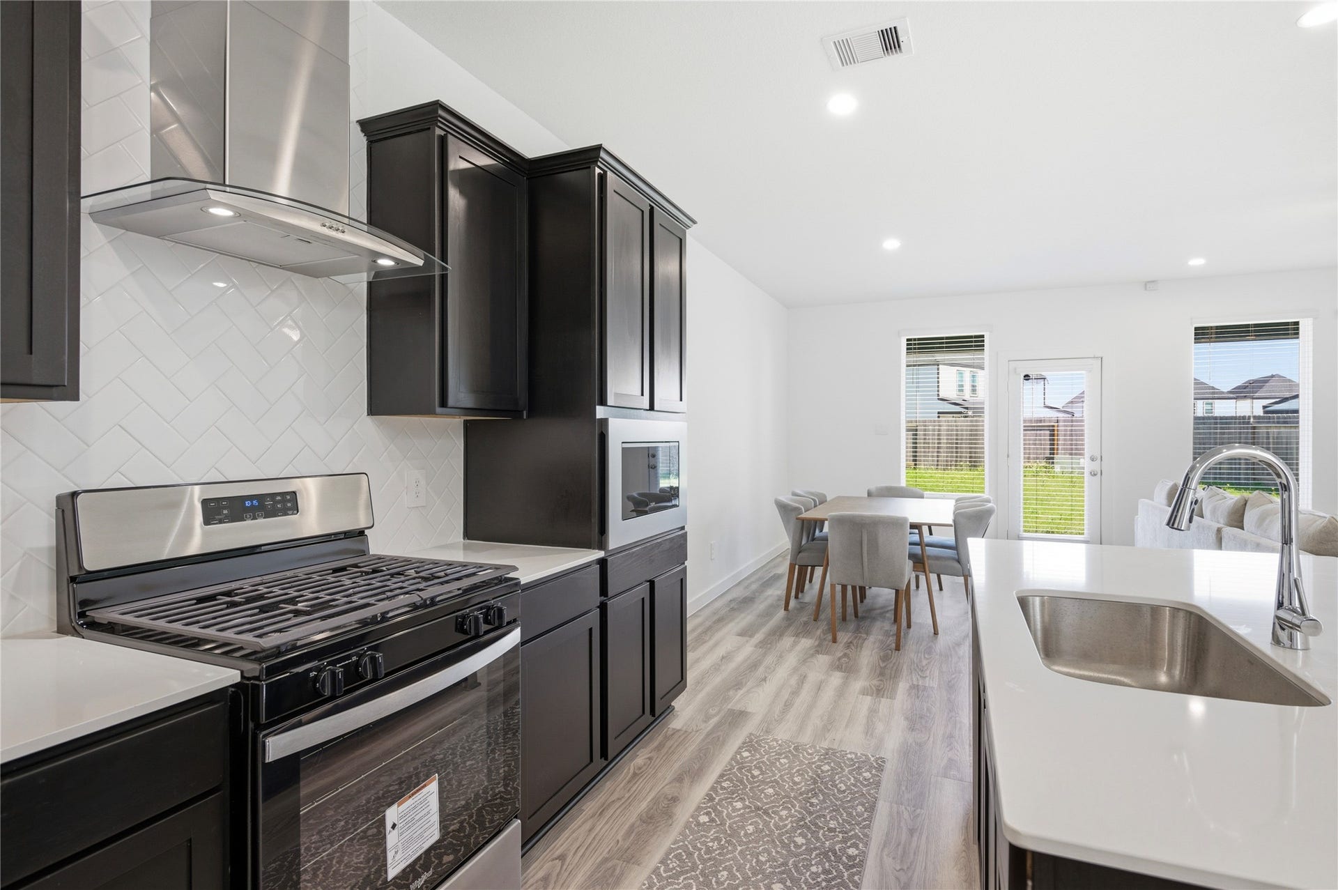 2919 Crown Gate Drive, Houston, TX 77047 Gas range with overhead vent.