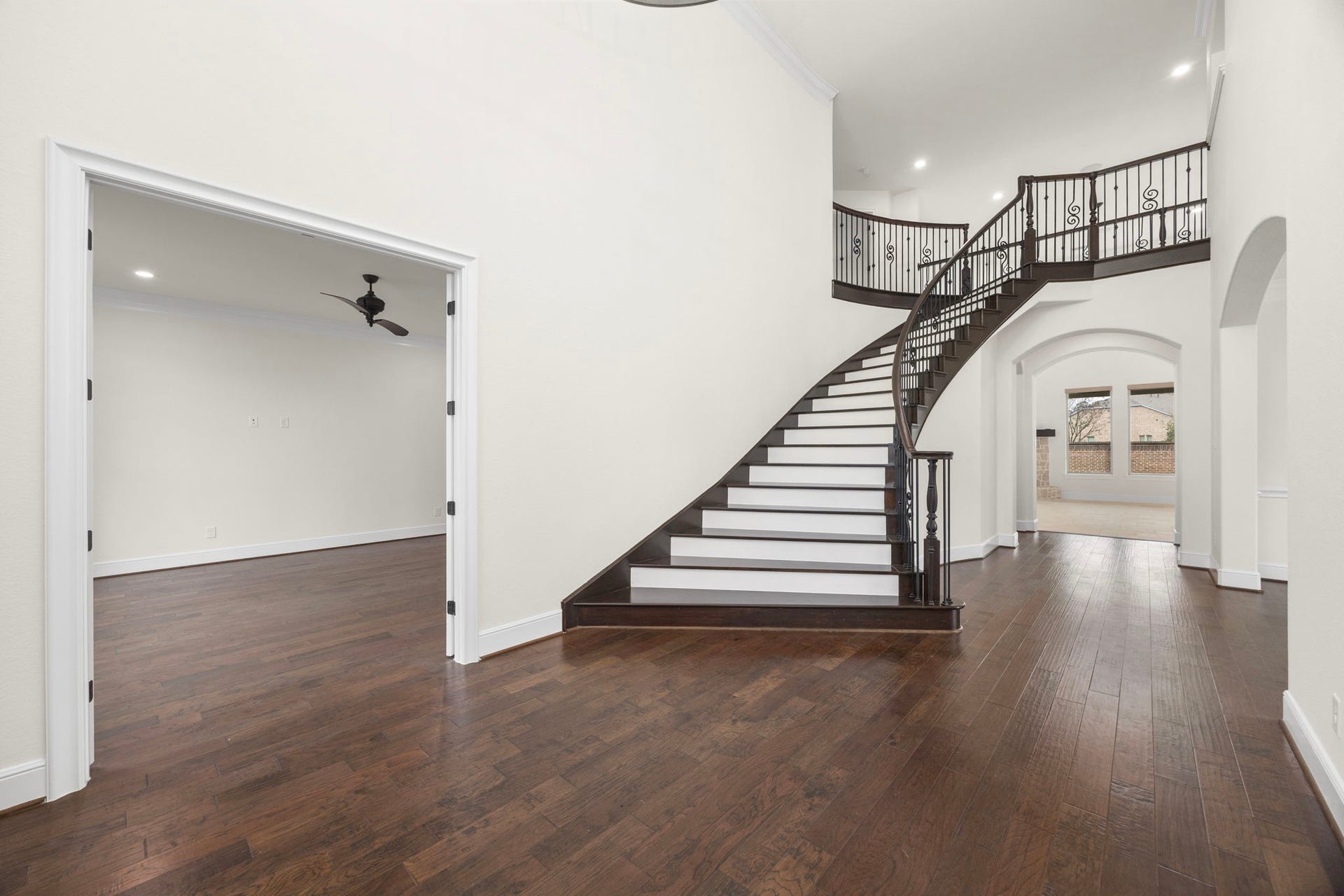 8551 Tombron Grove Road, Magnolia, TX 77354 Designed to feel open and inviting, the entry offers seamless sightlines into the main living spaces while maintaining a sense of formality.