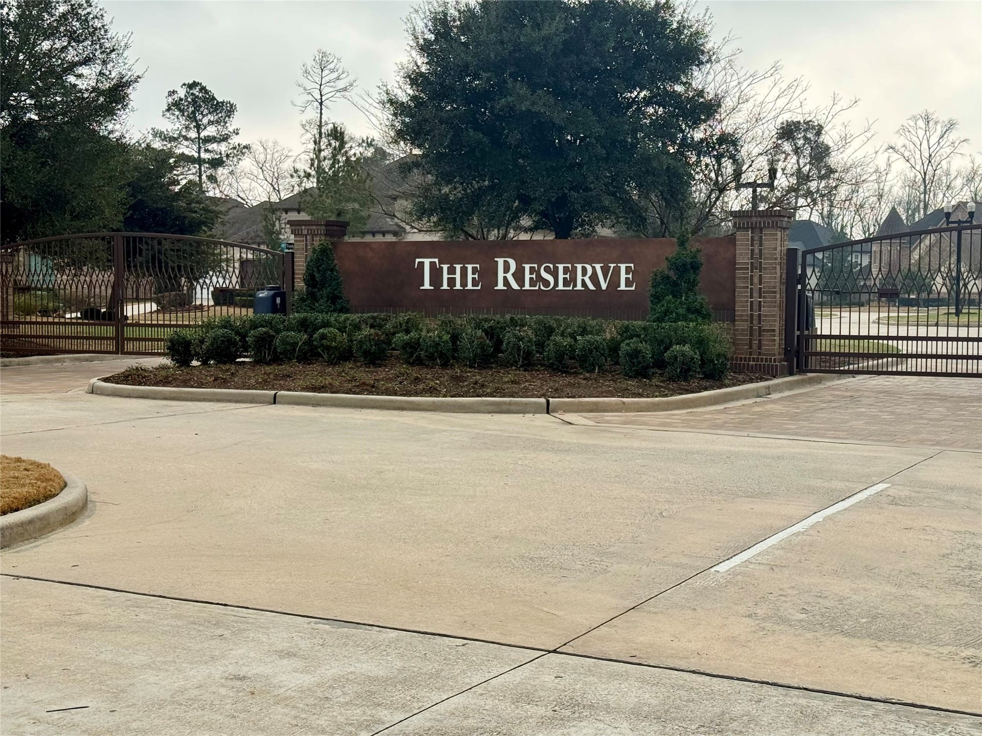 8551 Tombron Grove Road, Magnolia, TX 77354 The gated community entrance provides an impressive and secure welcome, setting the tone for the prestigious neighborhood beyond.