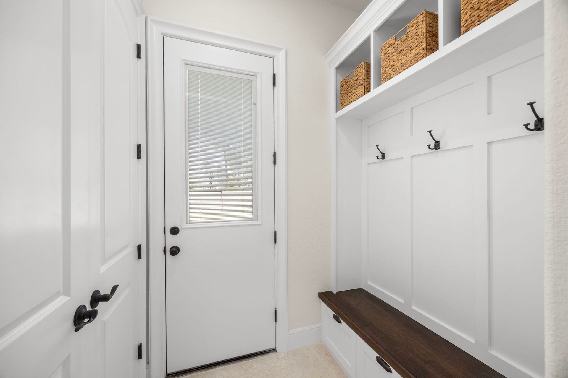 8551 Tombron Grove Road, Magnolia, TX 77354 This well appointed mud room provides functional and stylish transition space designed for everyday convenience. Built in storage and ample space for backpacks, shoes, and outerwear, the mud room is perfectly suited for busy households.