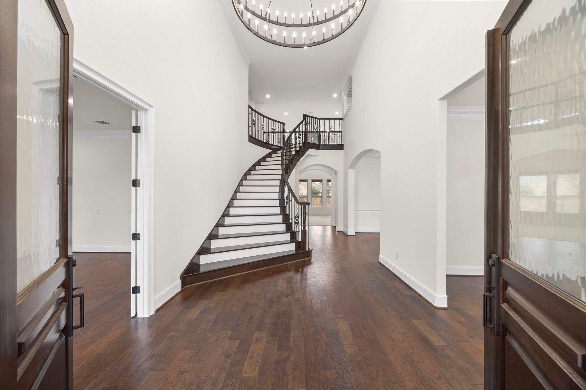 8551 Tombron Grove Road, Magnolia, TX 77354 Step inside to a breathtaking grand staircase that sets the tone for the elegant interior.