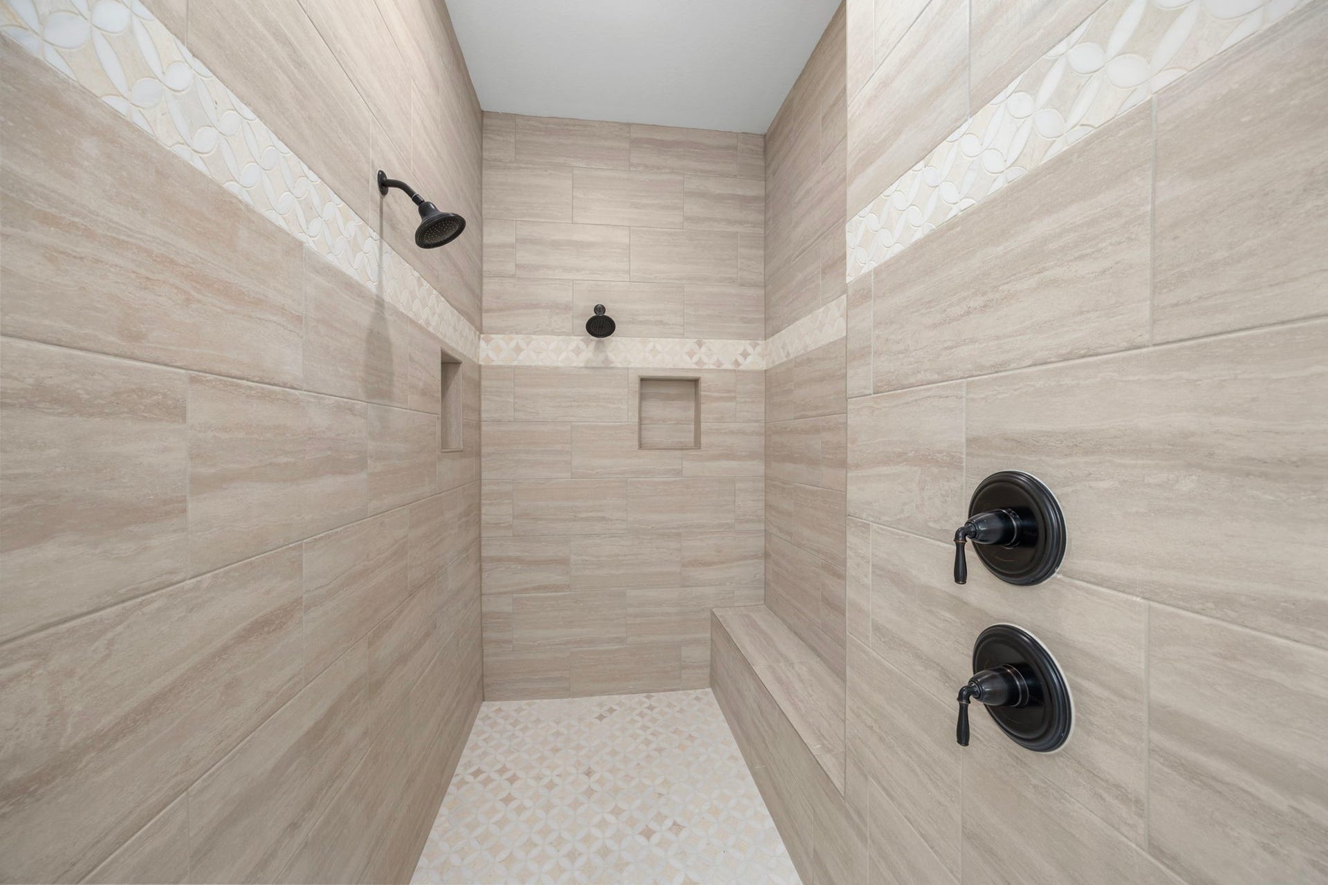 8551 Tombron Grove Road, Magnolia, TX 77354 Large oversized walk-in shower with dual shower heads, showcasing custom tile work and upscale finishes.