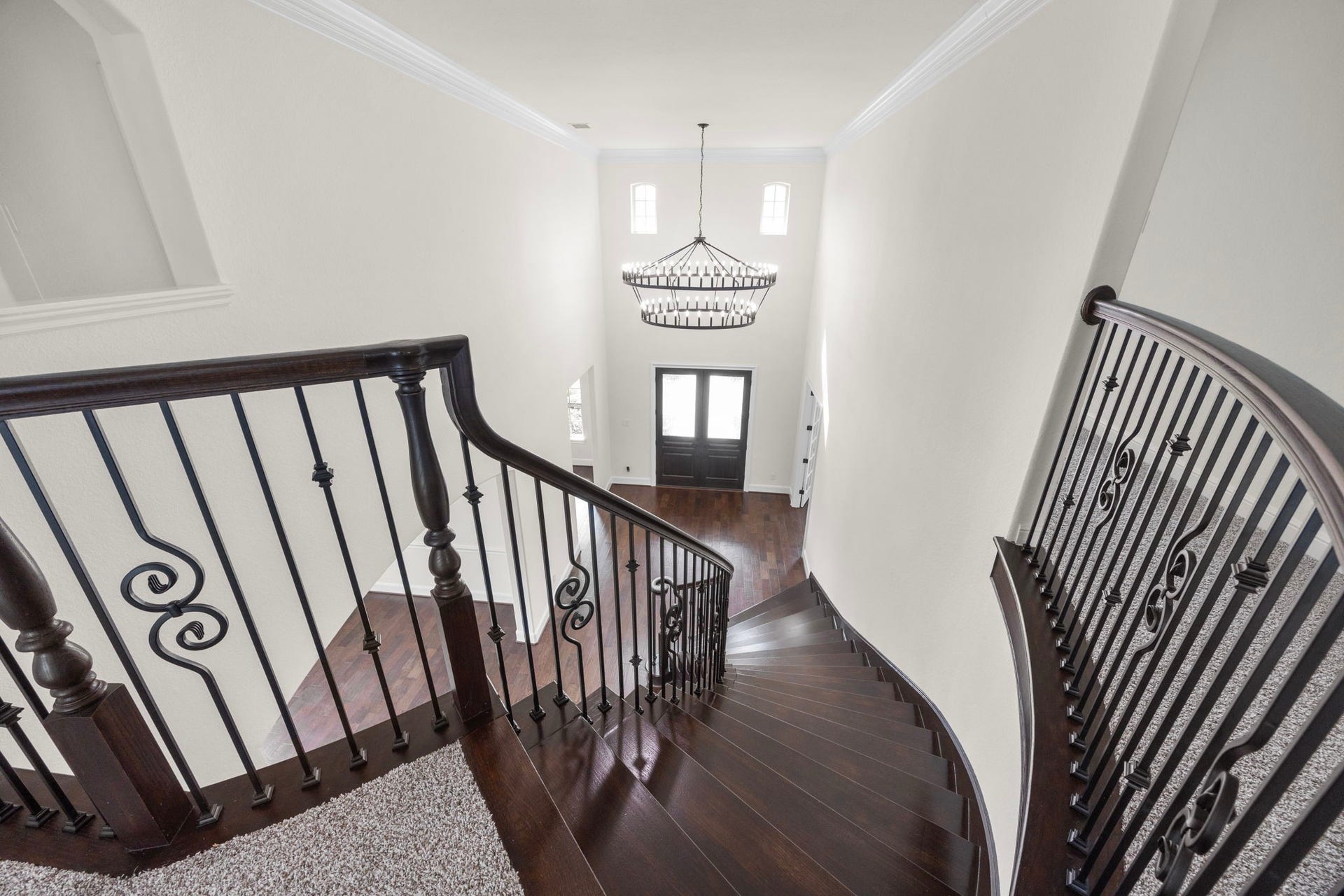 8551 Tombron Grove Road, Magnolia, TX 77354 At the top of the stairs, you are greeted by an elegant open landing that beautifully overlooks the dramatic foyer below.