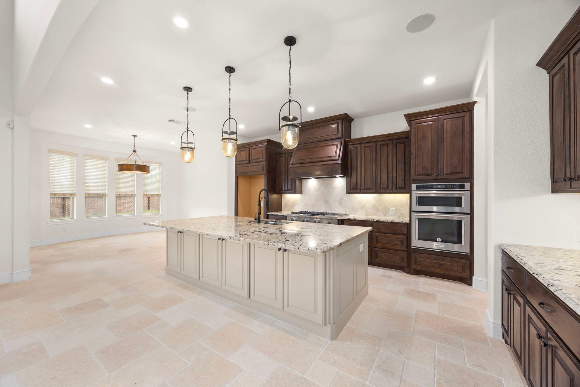 8551 Tombron Grove Road, Magnolia, TX 77354 Stunning culinary space combines beauty with exceptional functionality. Open-concept layout flows seamlessly into the massive family room for effortless gathering.