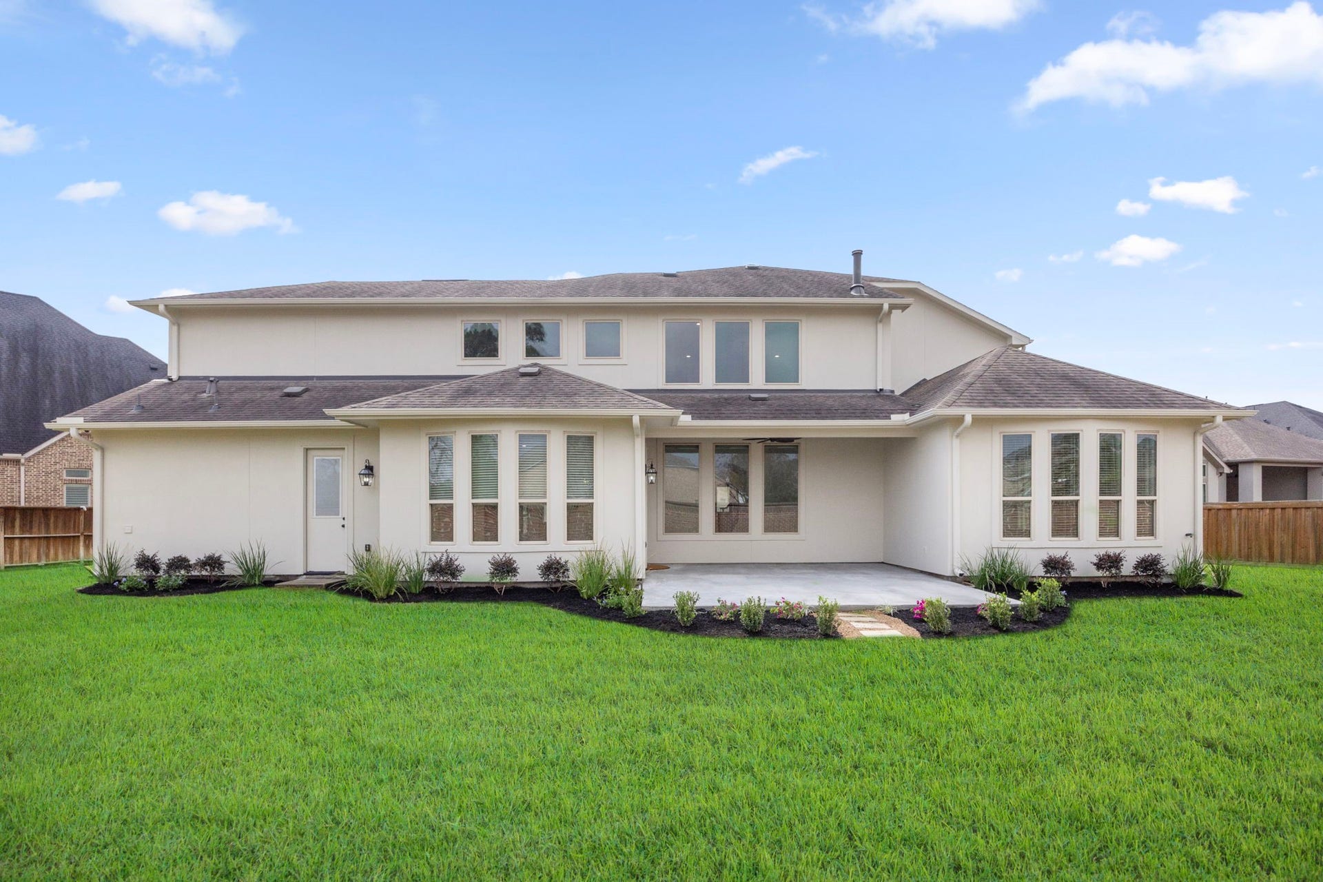8551 Tombron Grove Road, Magnolia, TX 77354 Overlooking the expansive backyard, the rear of the home offers excellent potential for outdoor enhancements while already delivering a private resort-like atmosphere ideal for relaxing or entertaining.