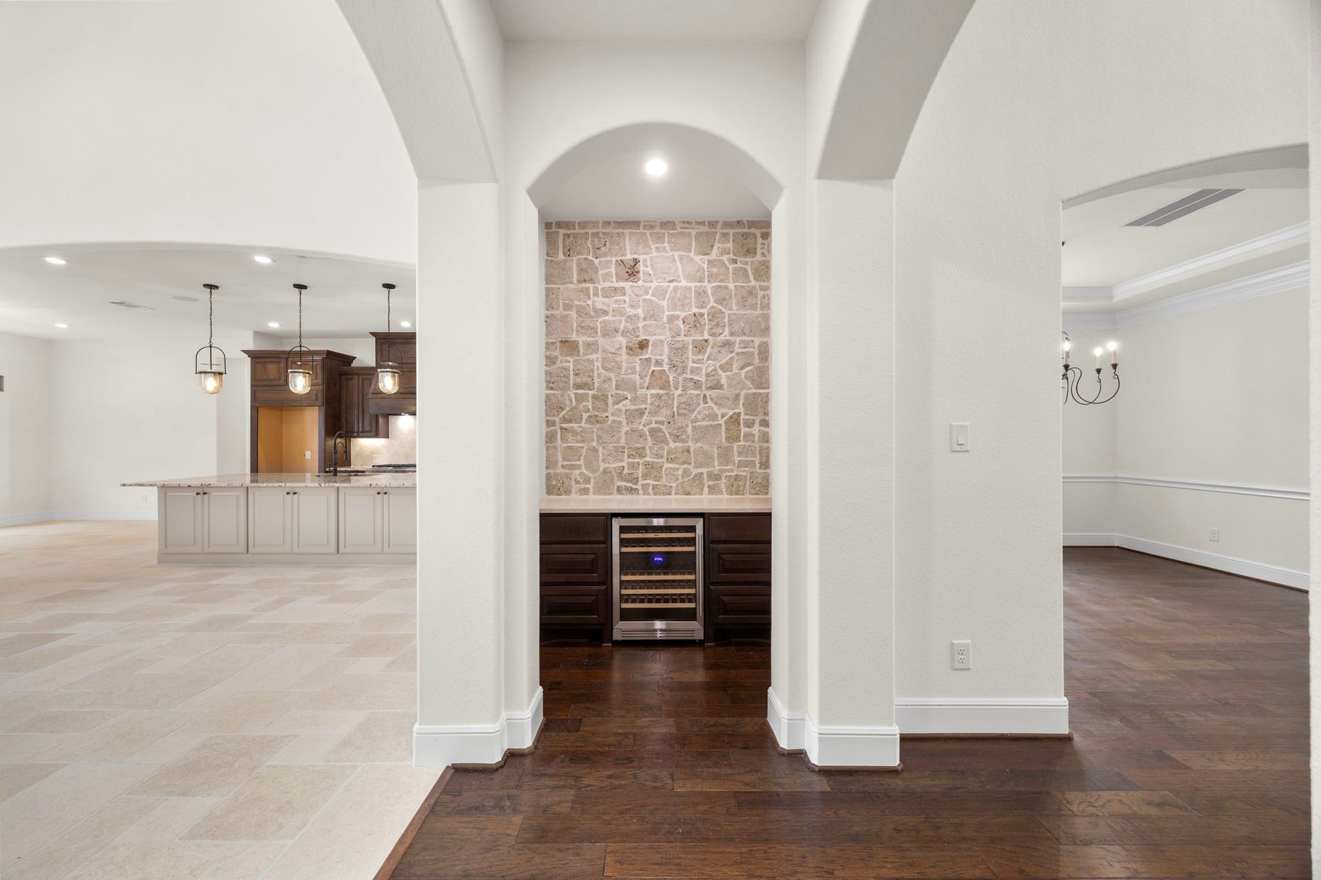 8551 Tombron Grove Road, Magnolia, TX 77354 Perfectly positioned for easy access from main living areas, the wine bar creates an ideal setting for hosting guests and entertaining.