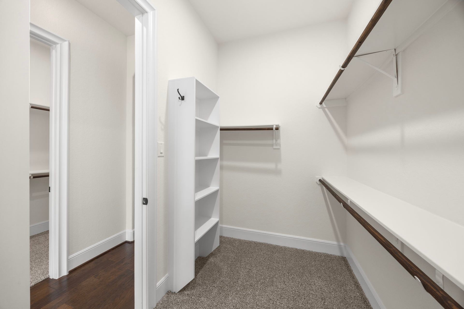 8551 Tombron Grove Road, Magnolia, TX 77354 The expansive walk-in closet is thoughtfully designed for exceptional organization. Featuring abundant shelving and built in storage.