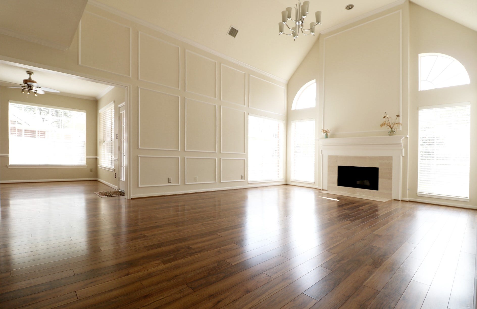 High ceiling and spacious family room with gorgeous fireplace