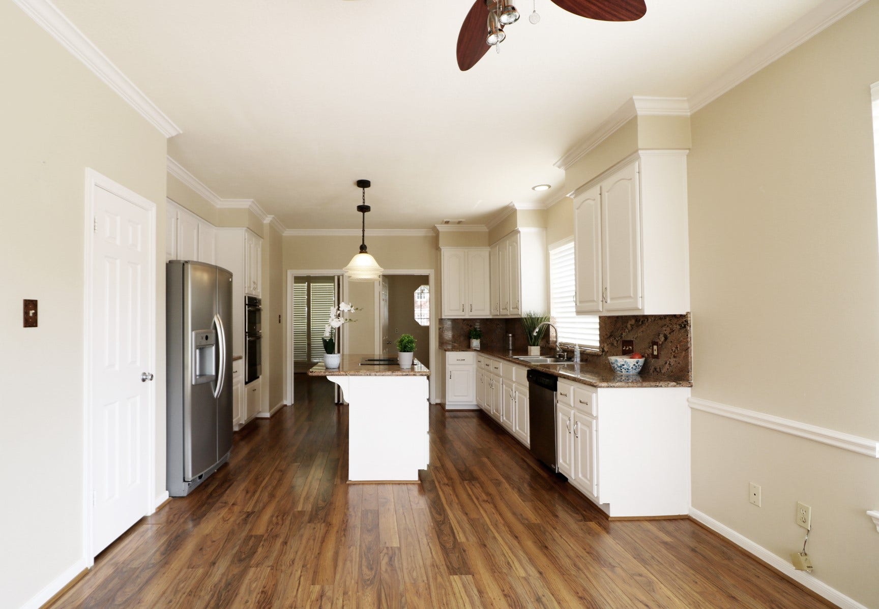 Kitchen with refrigerator and granite countertops