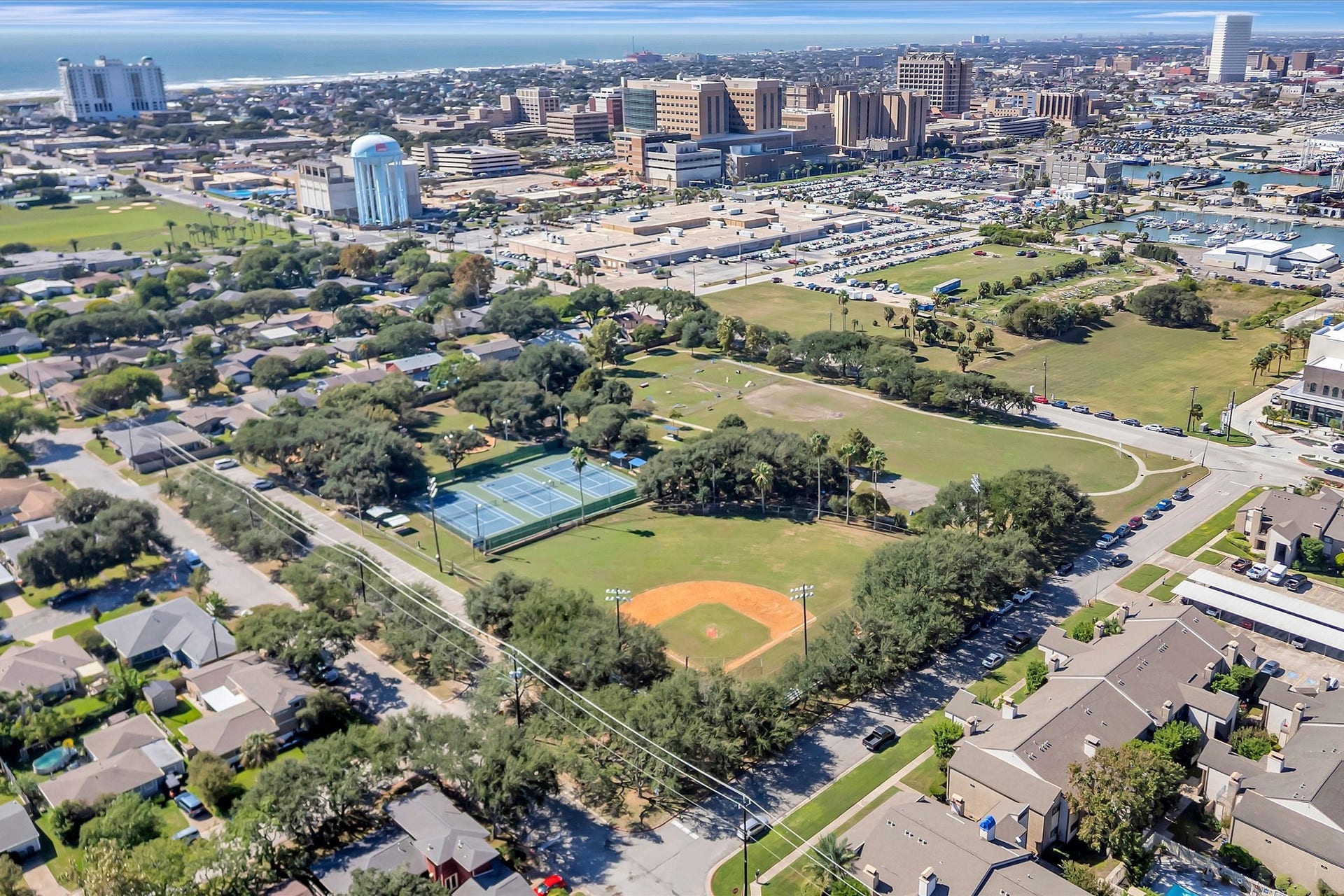 7071 N Holiday Drive, Galveston, TX 77550 Aerial overview of the condominium community and surrounding Galveston neighborhood.
