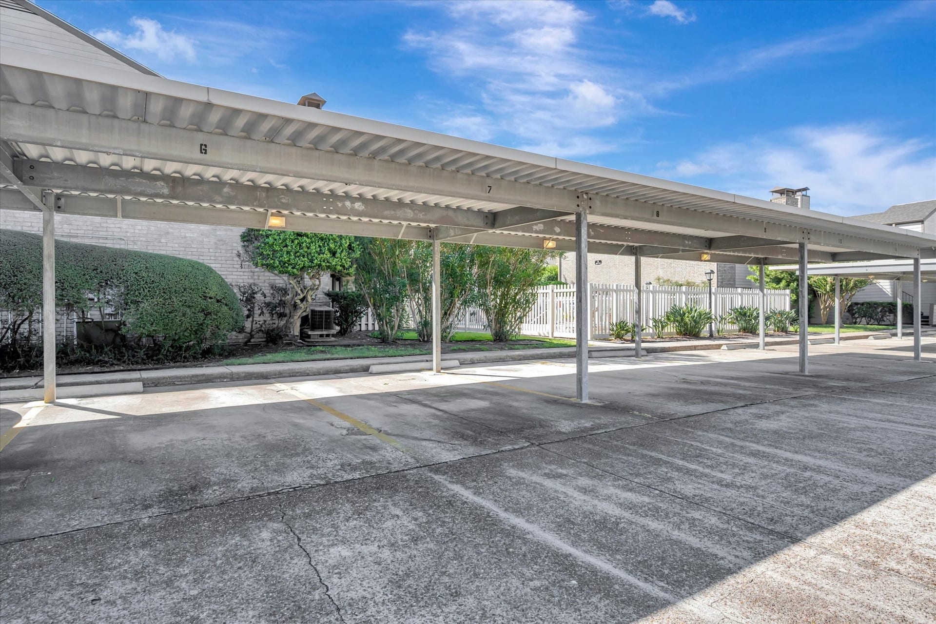 7071 N Holiday Drive, Galveston, TX 77550 Covered parking area within the condominium community.