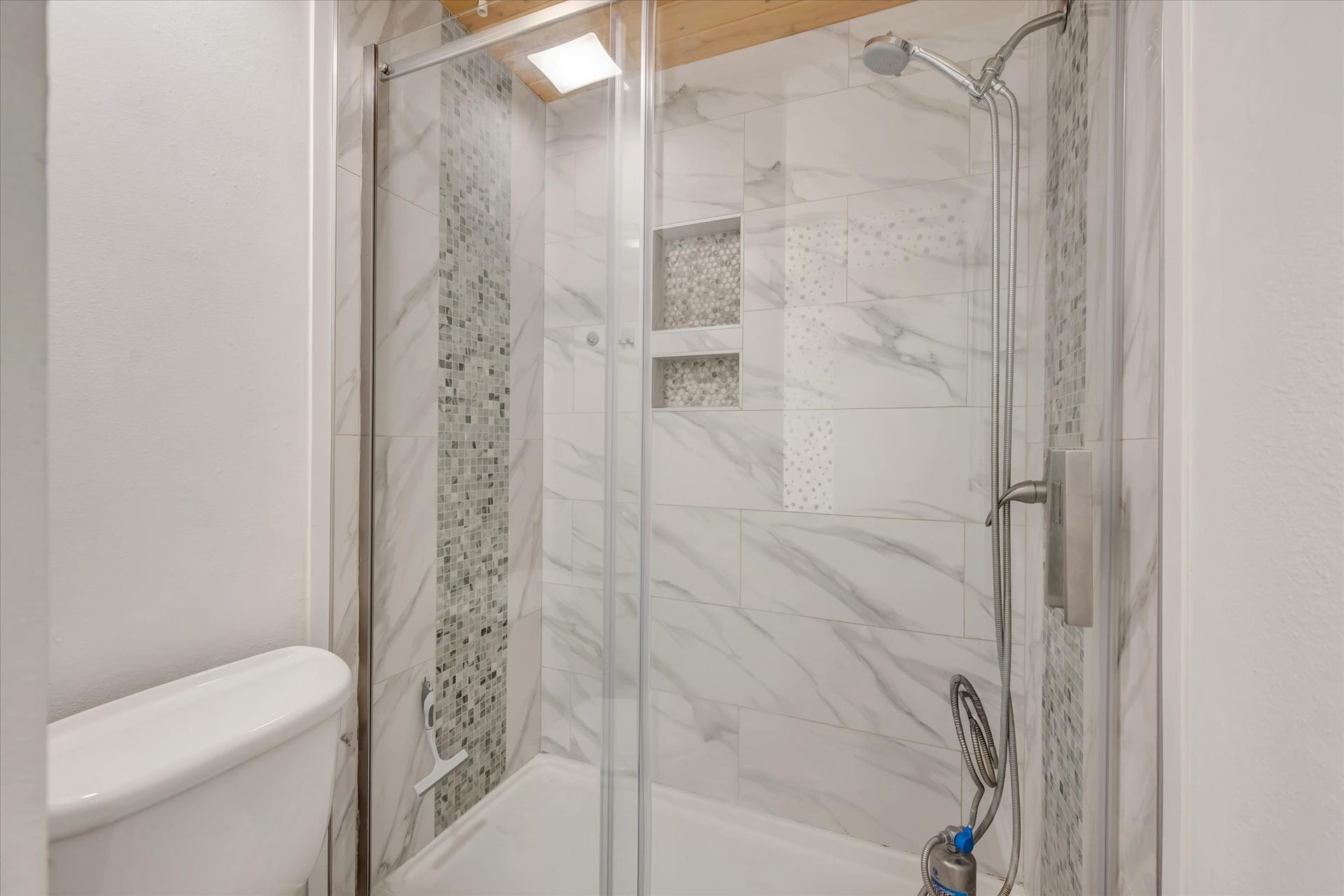 7071 N Holiday Drive, Galveston, TX 77550 Closer look at the glass-enclosed shower, replaced during the current ownership.