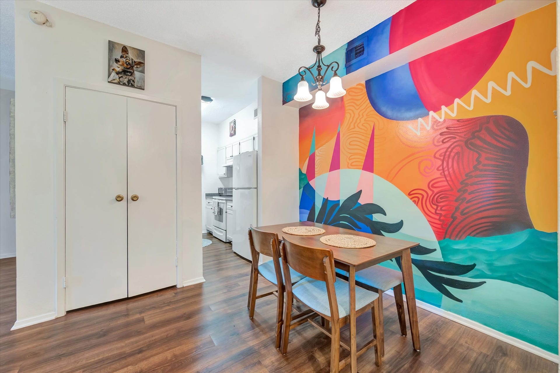 7071 N Holiday Drive, Galveston, TX 77550 Another view of the dining space highlights the murals bold colors and full-wall design.