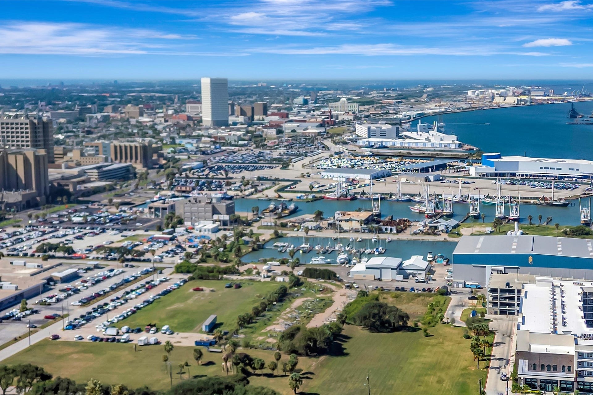 7071 N Holiday Drive, Galveston, TX 77550 Wide aerial view places the community within Galvestons coastal landscape.