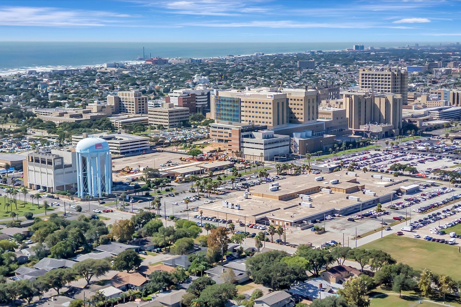 7071 N Holiday Drive, Galveston, TX 77550 Aerial perspective showing nearby development and the surrounding island setting.