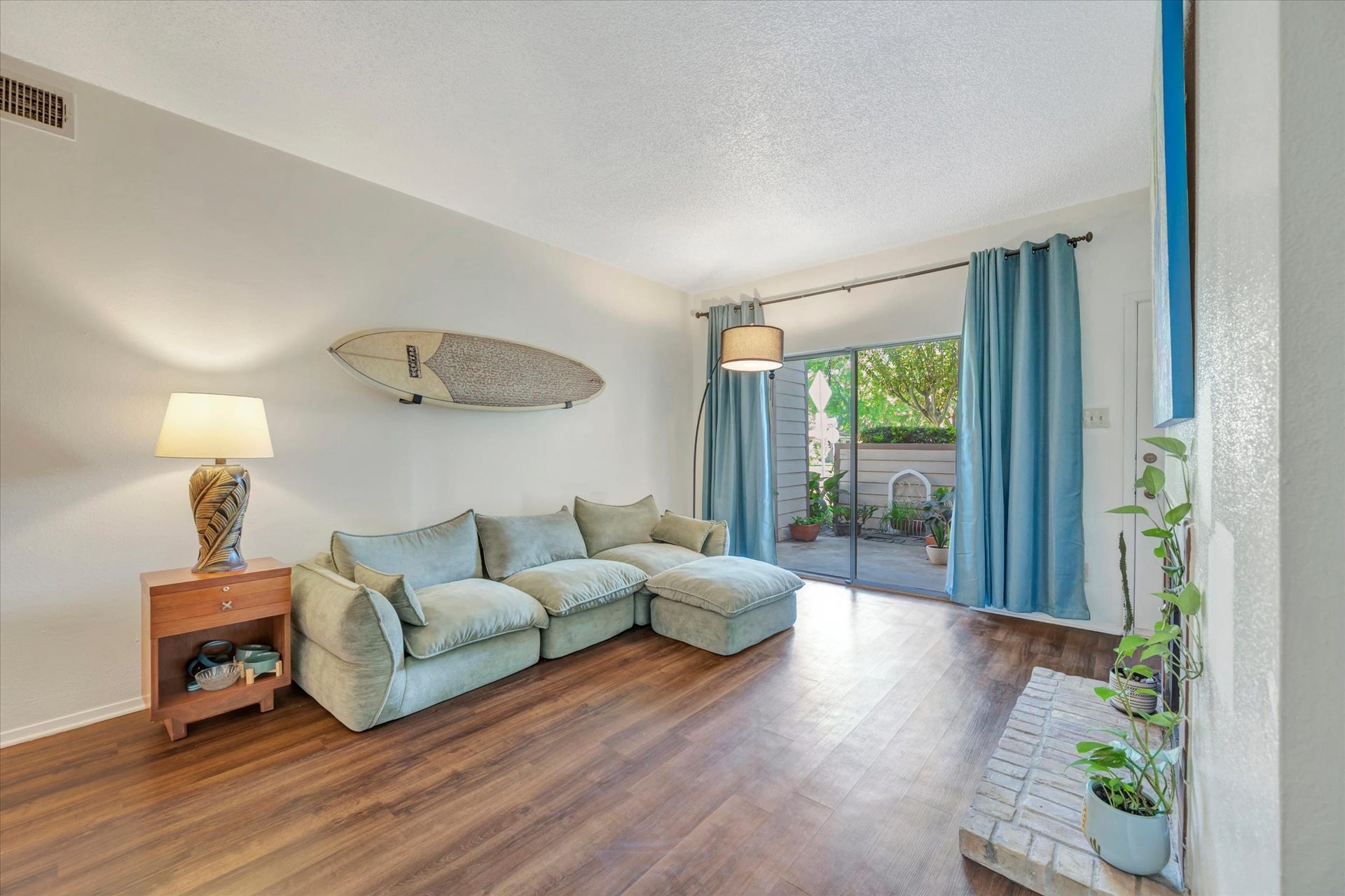 7071 N Holiday Drive, Galveston, TX 77550 Sliding glass doors bring natural light into the living area and provide access to the patio.