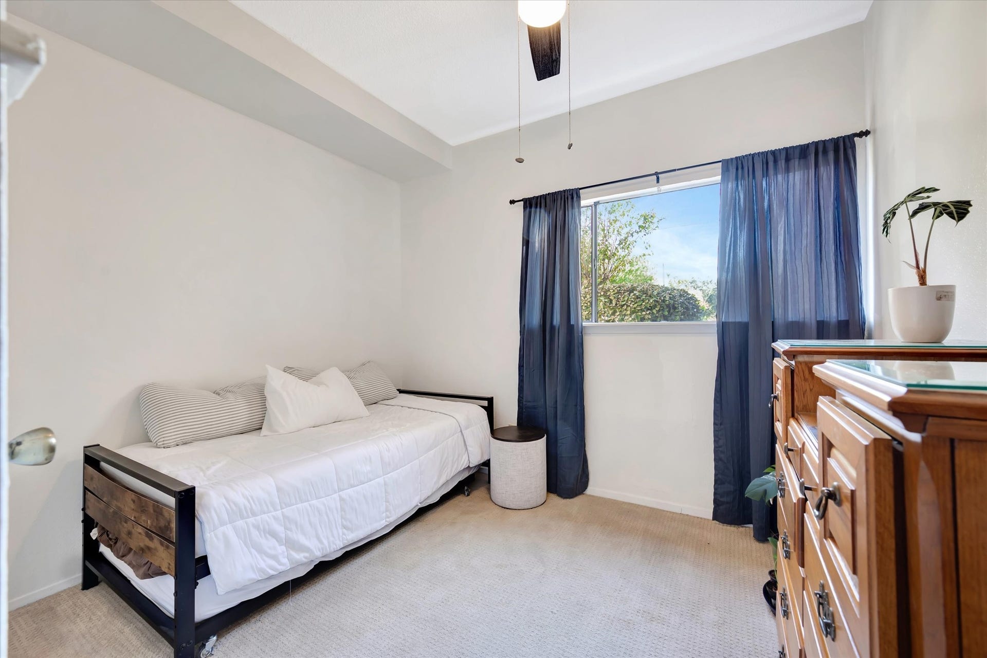 7071 N Holiday Drive, Galveston, TX 77550 Secondary bedroom with a window and space for guest accommodations or a home office.