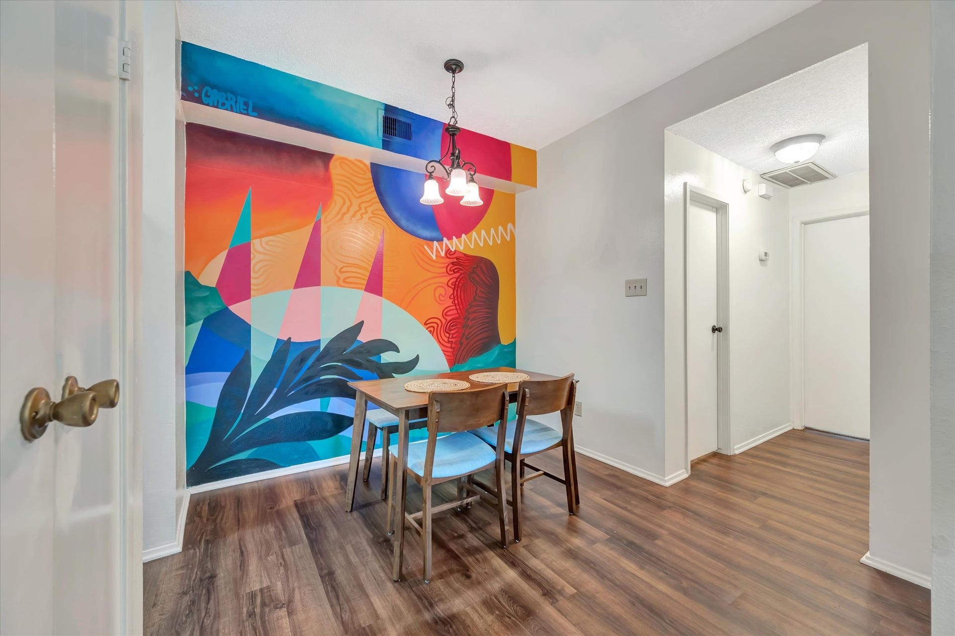 7071 N Holiday Drive, Galveston, TX 77550 Custom mural creates a distinctive backdrop for the dining area.
