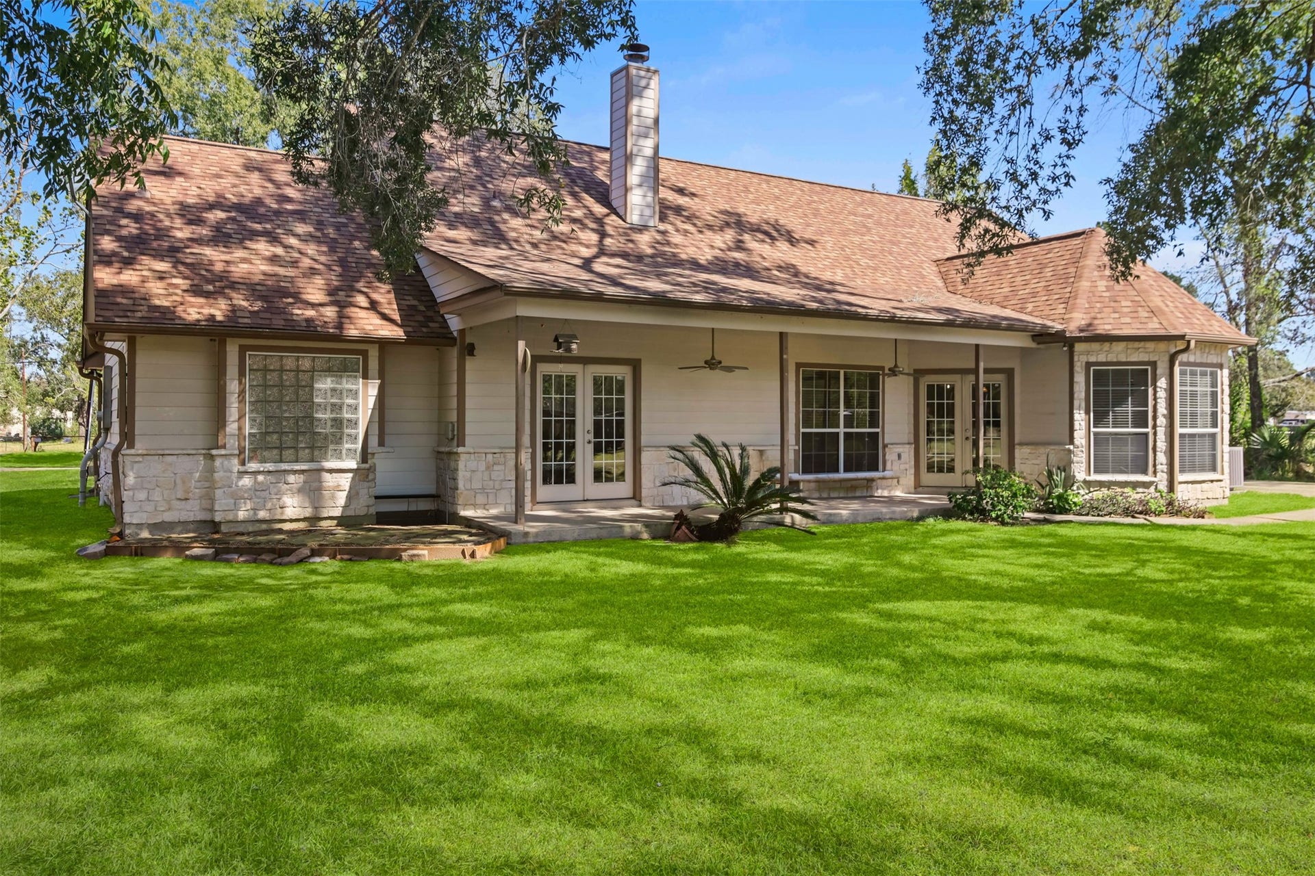 The covered porch with ceilings fans and deck offer a peaceful setting and are perfect for those stressful days where you just need to wind down. **Grass virtually enhanced**
