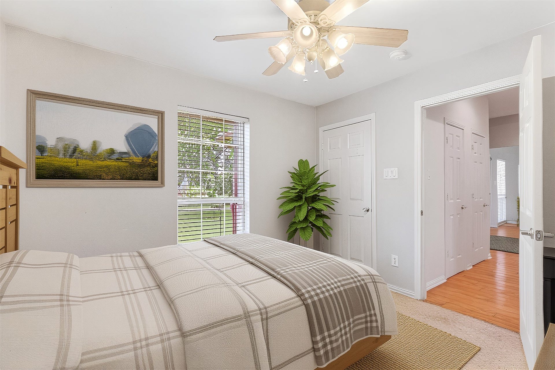 Another view of the secondary bedroom with a window view to the front of the property. *Virtually staged*