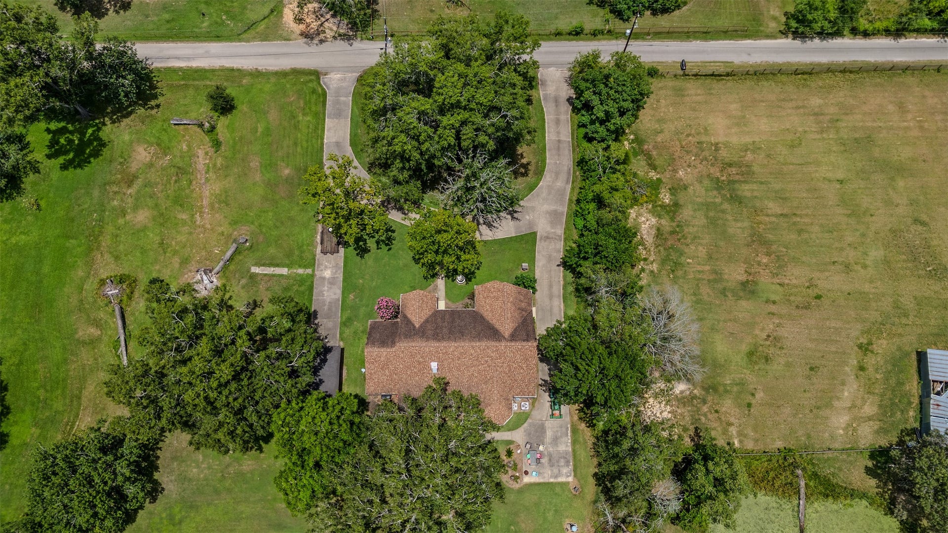 Aerial view of home and circle driveway.