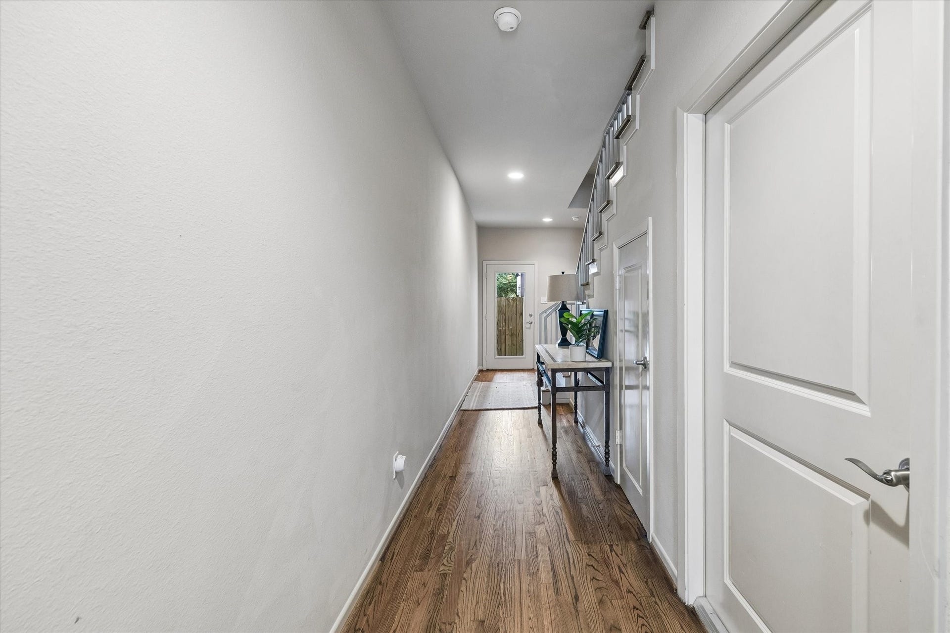 Upon entry into the home, you're greeted by a spacious entryway with garage access, large storage closet under the stairs, one secondary bedroom and outdoor patio