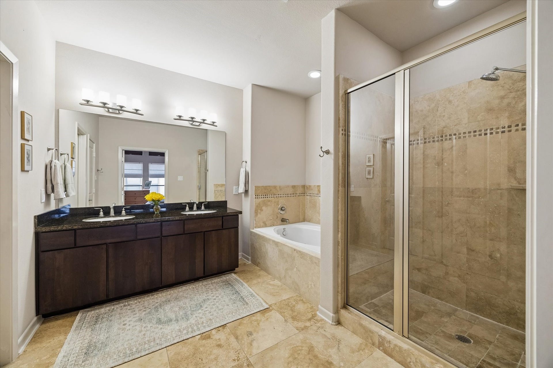 Primary bathroom with soaking tub, separate shower, double sinks and private water closet
