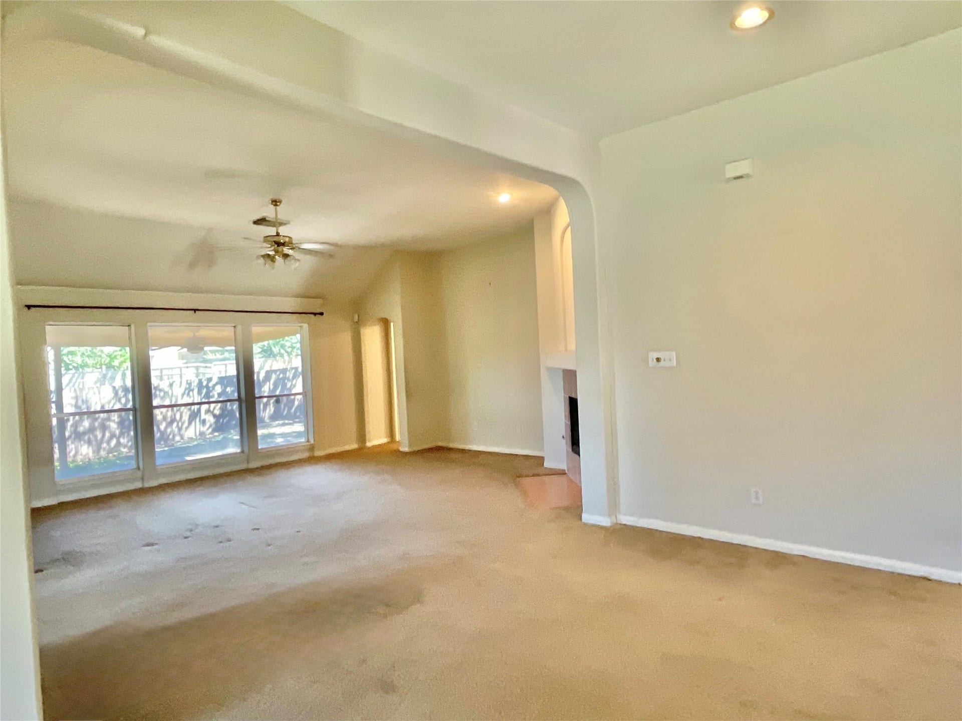 218 Willards Way, Stafford, TX 77477 Dining room view into family room, fireplace and primary bedroom door