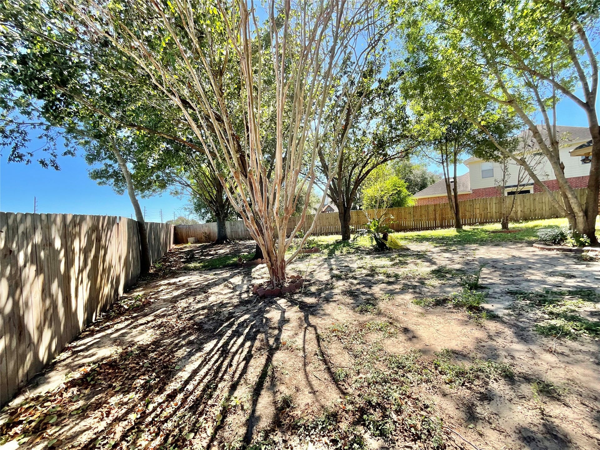 218 Willards Way, Stafford, TX 77477 Backyard to right side of back porch along fence line