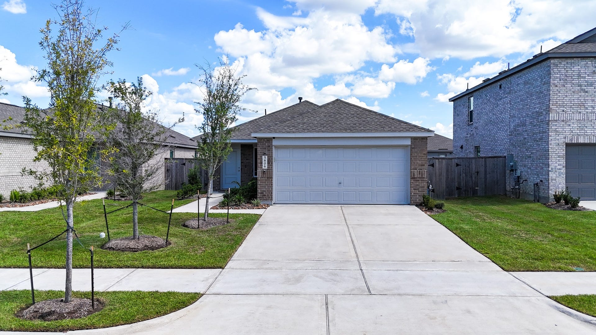 5806 Standpiper Loop, Baytown, TX 77521 An immaculate two-car garage paired with an expansive concrete driveway offers plenty of parking for family and guests.