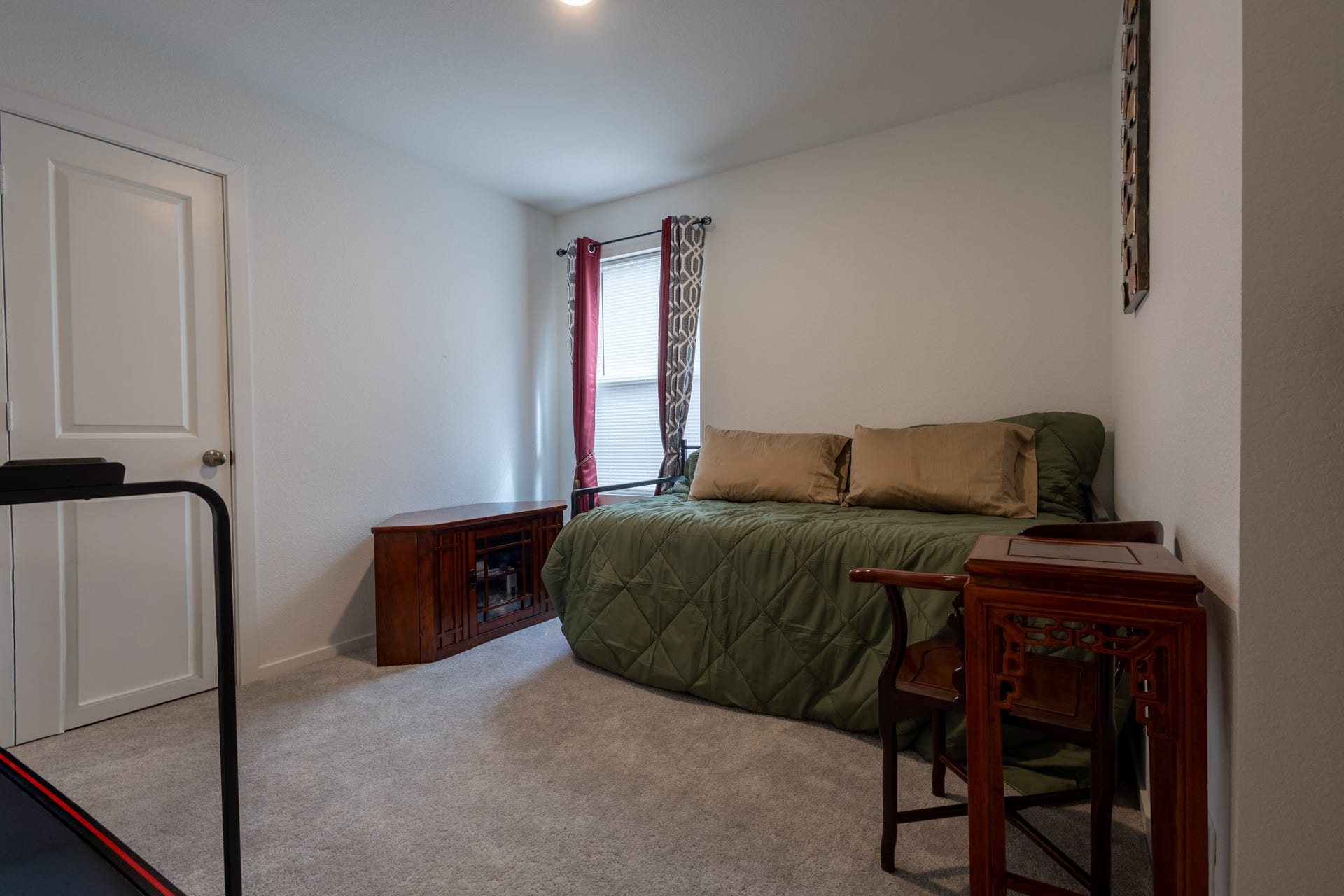 5806 Standpiper Loop, Baytown, TX 77521 A bright, spacious secondary bedroom outfitted with a custom window blind and premium ceiling fanperfect for kids, guests, or a home office.