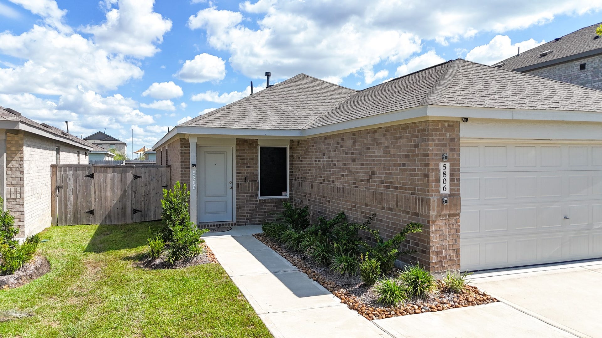 5806 Standpiper Loop, Baytown, TX 77521 A welcoming, low-maintenance front entry porch sets the tone for the clean lines and meticulous care found throughout the entire property.