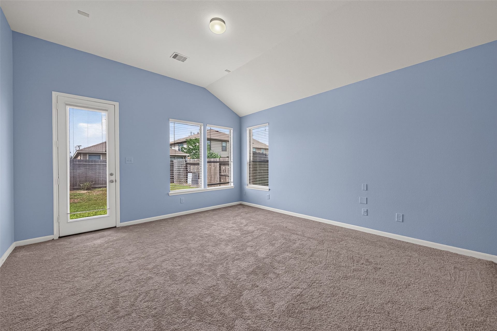 22506 Auburn Valley Lane, Katy, TX 77449 Back of family room with backyard door and windows