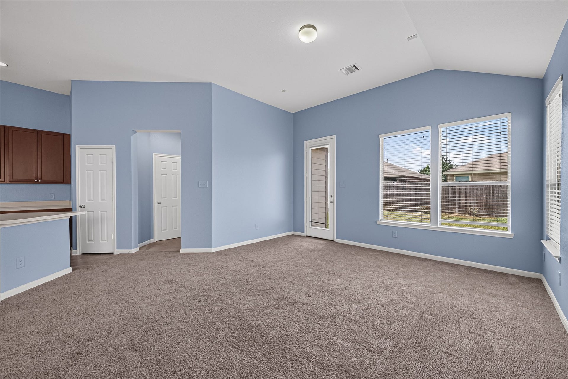 22506 Auburn Valley Lane, Katy, TX 77449 Back of family room with backyard door and windows