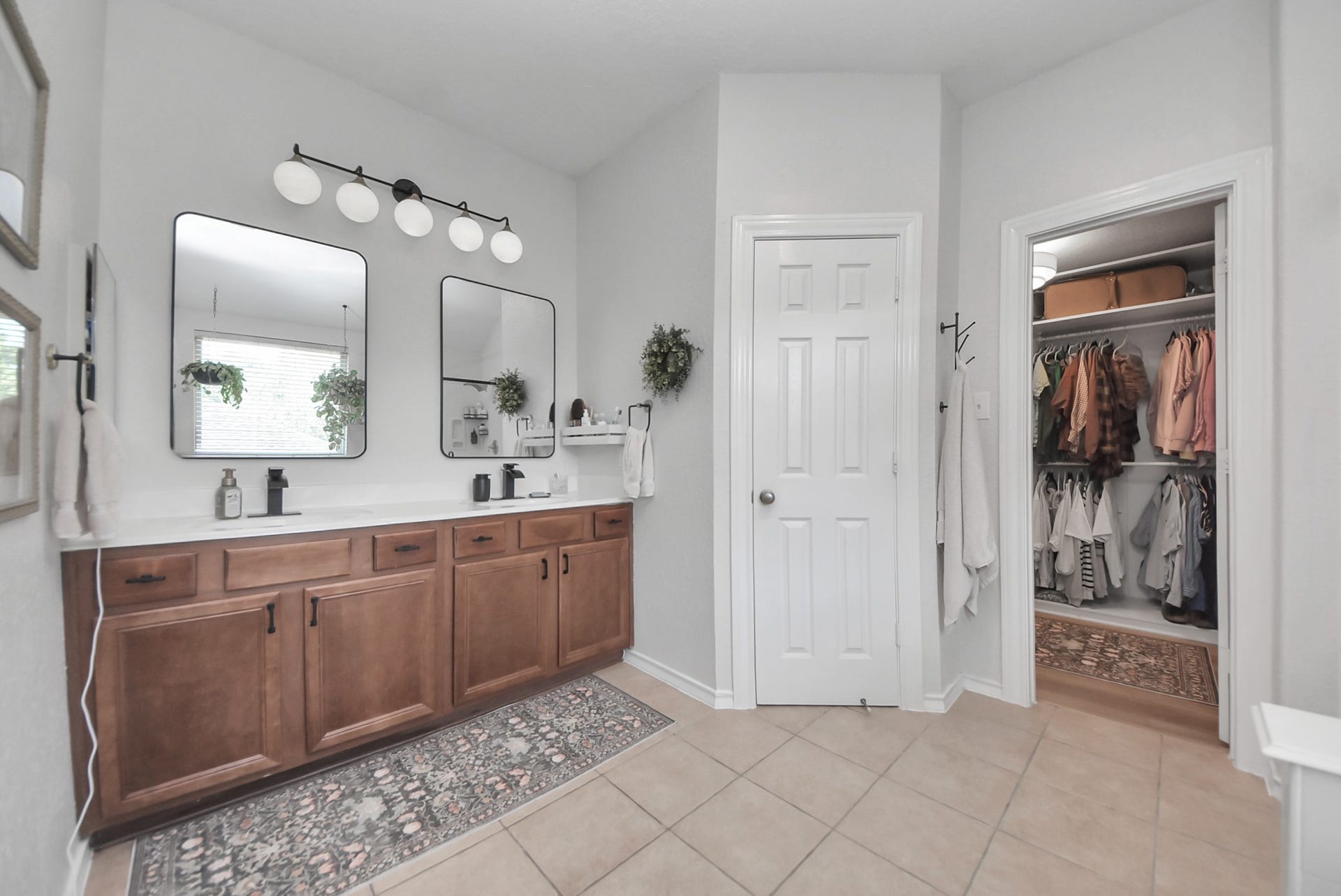 Notice the double-sink vanity with upgraded hardware and lighting.