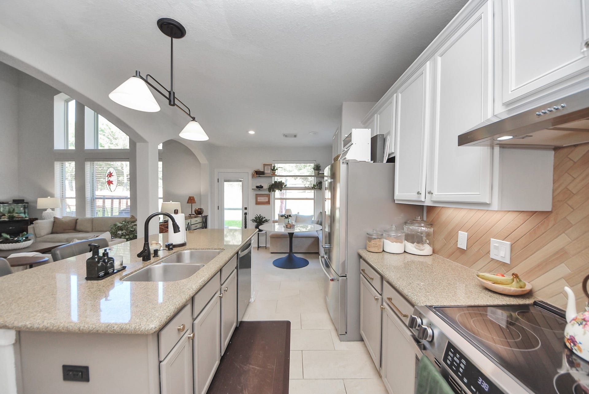 The formal dining room flows elegantly into the upgraded kitchen and breakfast nook