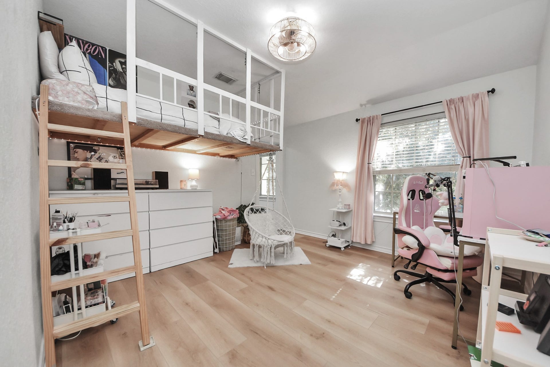 A light and bright secondary bedroom with a custom-built loft bed and closet organization system, perfect for maximizing space.