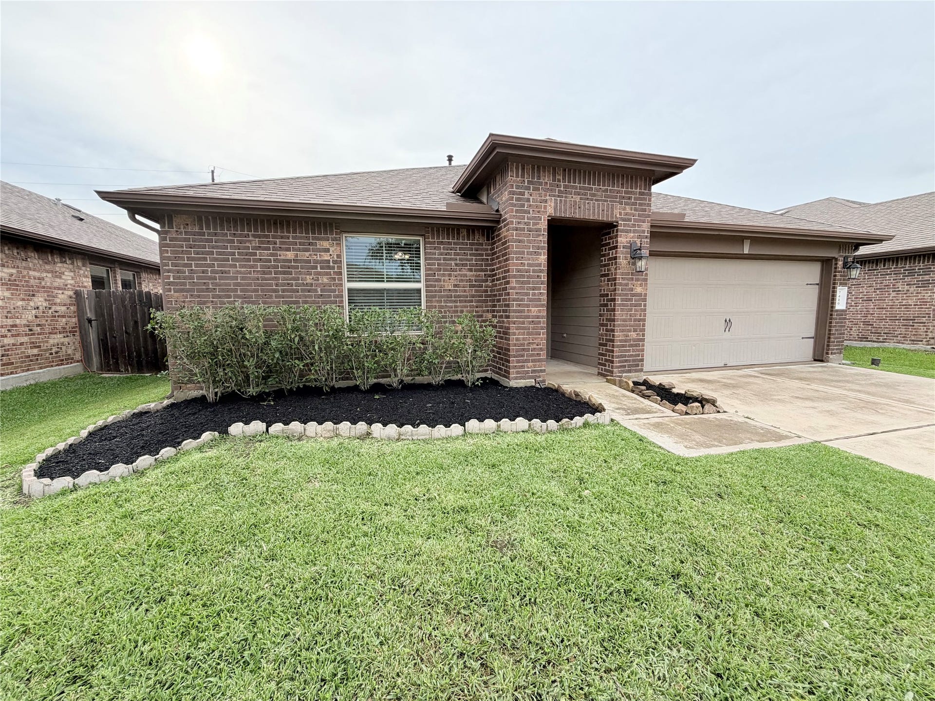Welcome home! Charming curb appeal with a covered front entry and landscaped flower beds.
